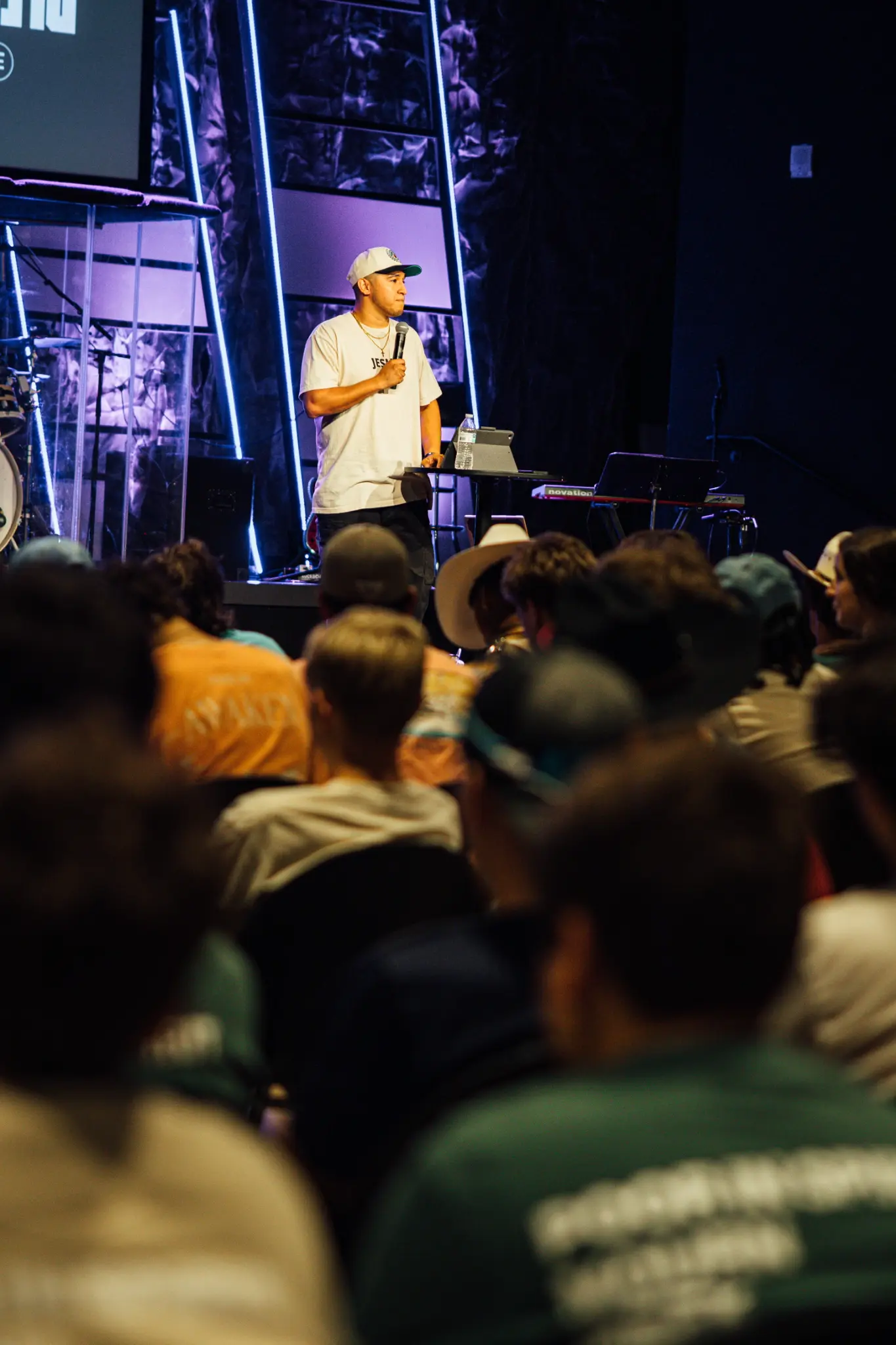 Speaker preaching to students at a RAGE Ministries event