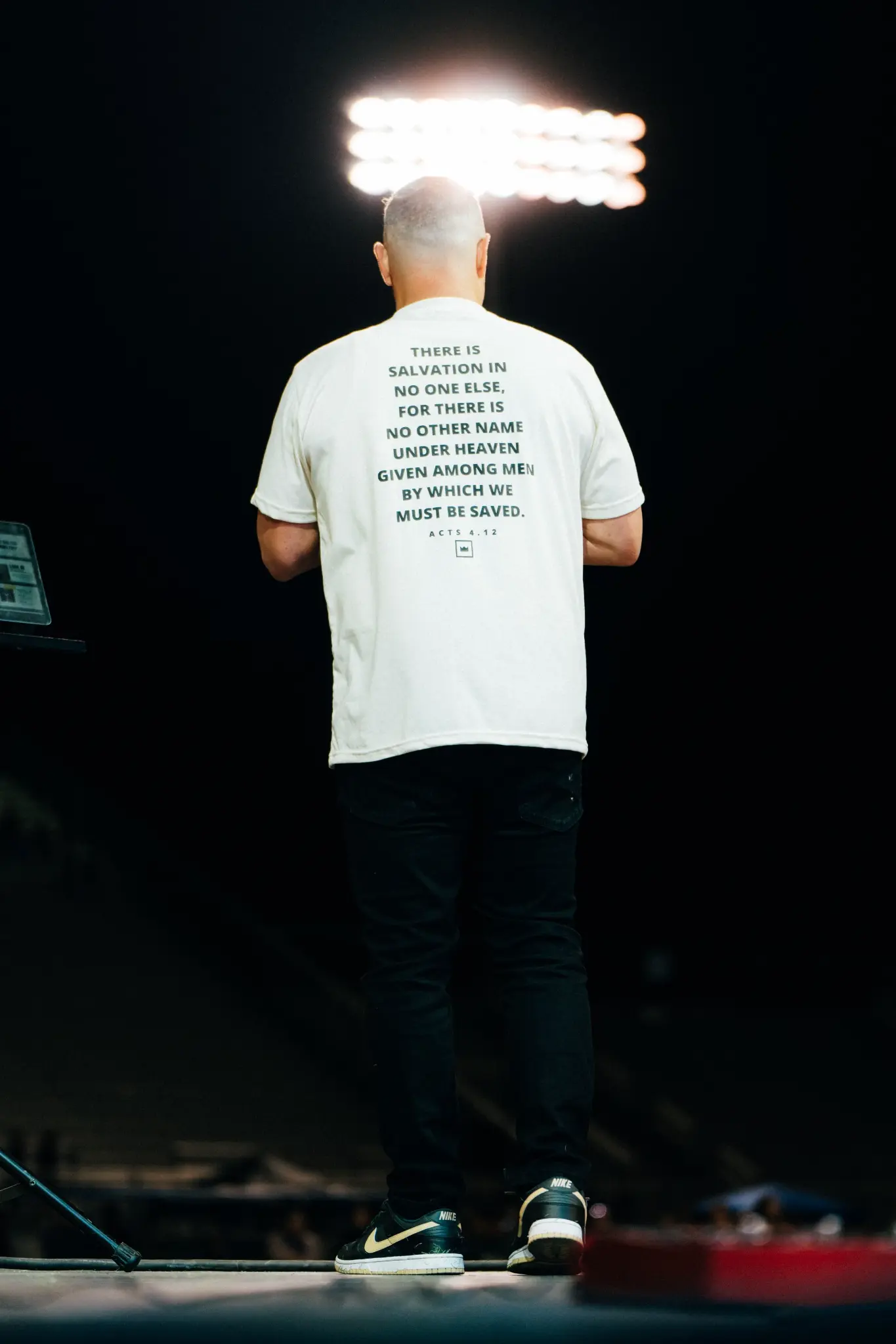Speaker on stage — There is salvation in no one else